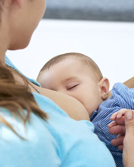 Medela - baby being breastfeed by mother.